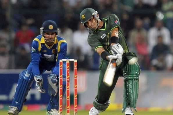 Pakistan's cricket captain Misbah-ul-Haq (R) plays a shot as Pakistan's wicketkeeper Kumar Sangakkara look on during the Twenty20 match between Pakistan and Sri Lanka at the Sheikh Zayed Cricket Stadium in Abu Dhabi. Pakistan beat Sri Lanka by five wickets in a thrilling finish to the only Twenty20 international played at Abu Dhabi stadium here on Friday. Pakistan's cricket captain Misbah-ul-Haq (R) plays a shot as Pakistan's wicketkeeper Kumar Sangakkara look on during the Twenty20 match between Pakistan and Sri Lanka at the Sheikh Zayed Cricket Stadium in Abu Dhabi. Pakistan beat Sri Lanka by five wickets in a thrilling finish to the only Twenty20 international played at Abu Dhabi stadium here on Friday.