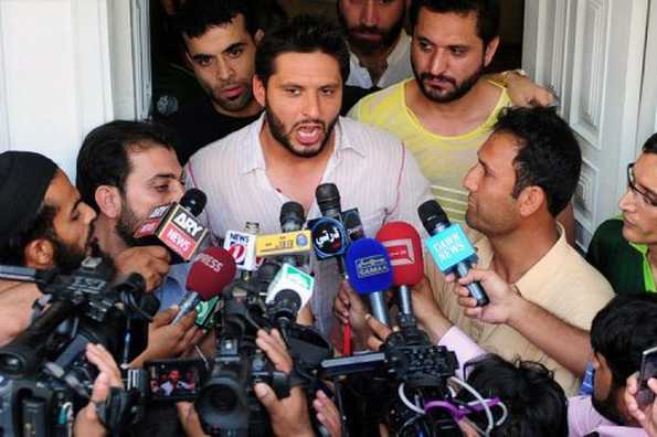Pakistan World Cup captain Shahid Afridi speaks to media outside his home on Friday after his arrival back from India. Afridi said his derogatory remarks about Indians and the Indian media had been taken out of context as he sought to counter anger over the comments. Pakistan World Cup captain Shahid Afridi speaks to media outside his home on Friday after his arrival back from India. Afridi said his derogatory remarks about Indians and the Indian media had been taken out of context as he sought to counter anger over the comments.