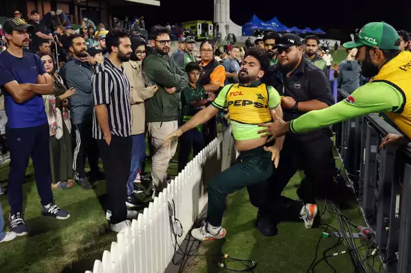 Khushdil Shah being held back by the police during the altercation Khushdil Shah being held back by the police during the altercation