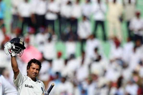 Indian batsman Sachin Tendulkar celebrates after becoming the leading run-getter in Tests in Mohali on October 17, 2008. Tendulkar was at it again on Friday, breaking yet another record -- that of leading Test scorer -- to cement his place as one of cricket's finest ever batsmen. Indian batsman Sachin Tendulkar celebrates after becoming the leading run-getter in Tests in Mohali on October 17, 2008. Tendulkar was at it again on Friday, breaking yet another record -- that of leading Test scorer -- to cement his place as one of cricket's finest ever batsmen.