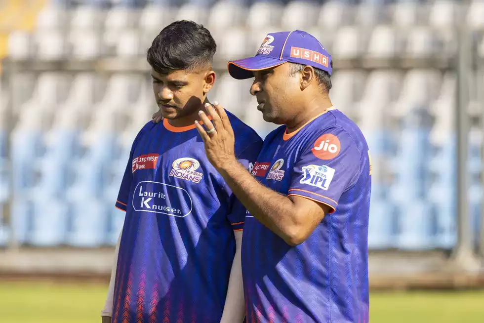 Ashwani Kumar is seen listening to head coach Mahela Jayawardene during training. Ashwani Kumar is seen listening to head coach Mahela Jayawardene during training.